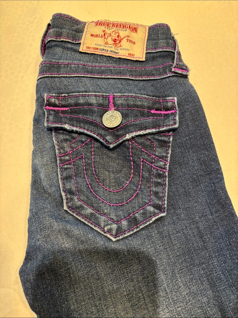 True Religion Skinny Jeans in Dark Blue with Purple Stitching